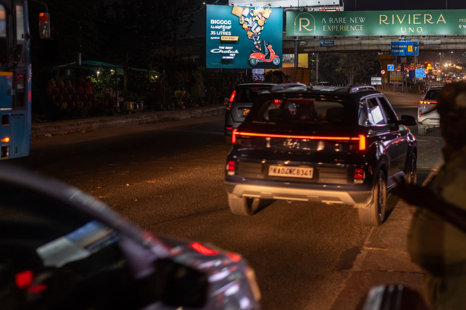Night-time Hebbal hoarding viewed from the approach lane